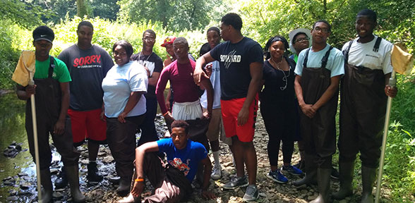 The City of Wilmington Green Jobs program interns conduct stream assessments in the First State National Historical Park.