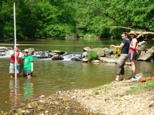 Field crew measuring White Clay Creek Dam No. 2 May 2010